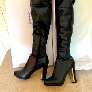 Calvin Klein Black Boots With scratch by heal and zipper Used 4 times 7 1/2.